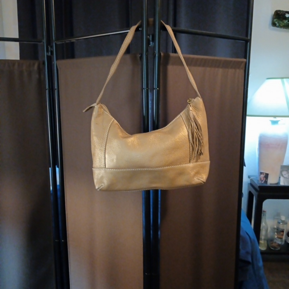 The SAK Pink Label Gold Pebble Leather Fringe Shoulder Bag.